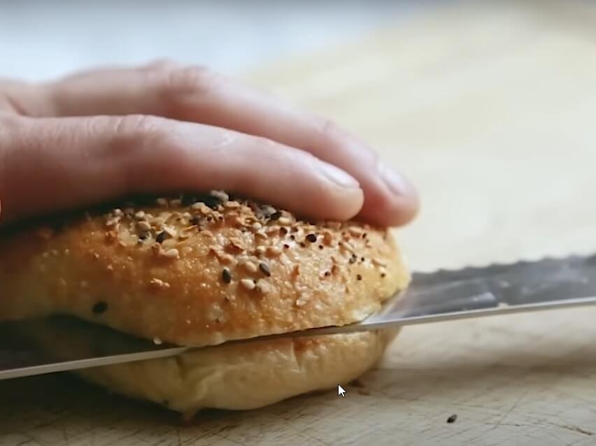Bagels with cream cheese slice in half